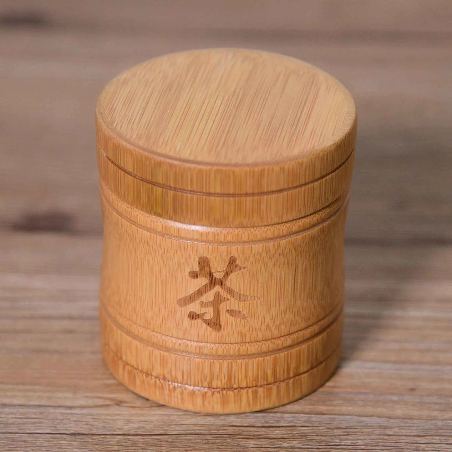 Bamboo container with engraved symbol for sustainable tea storage solutions by Tea and coffee of the world