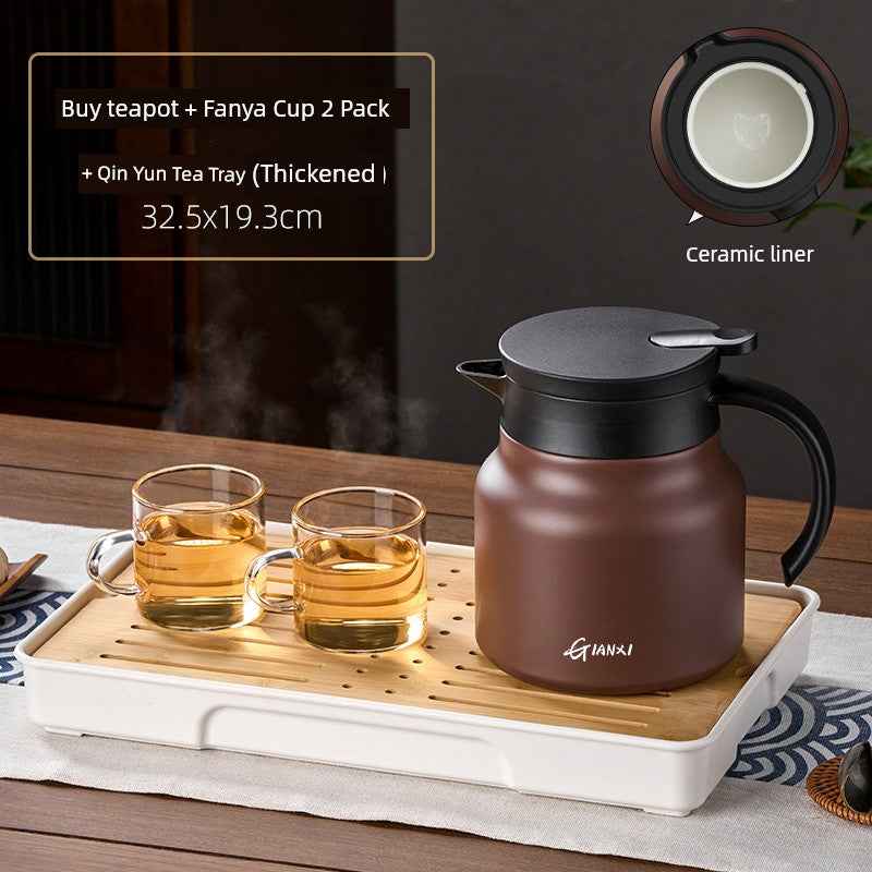 High-quality braised teapot with ceramic liner and matching glass cups on a bamboo tea tray