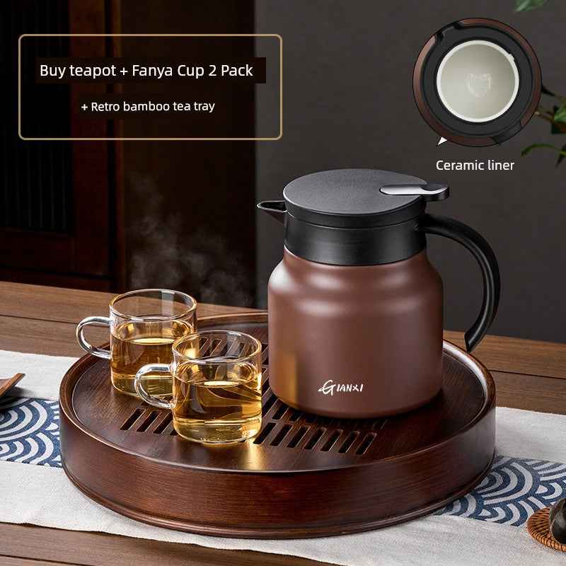 High-quality braised teapot with ceramic liner and two glass cups on a retro bamboo tea tray