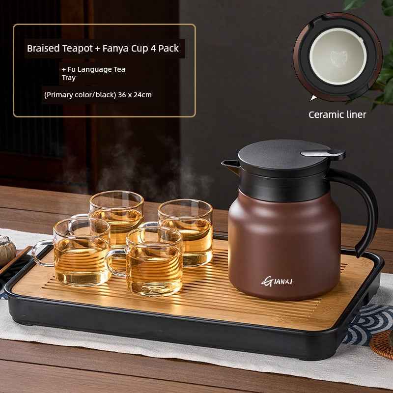 High-quality braised teapot with ceramic liner and four glass cups on a wooden tea tray set