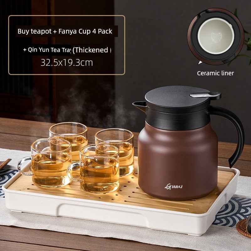 High-quality braised teapot with ceramic liner and four glass cups on a wooden tray