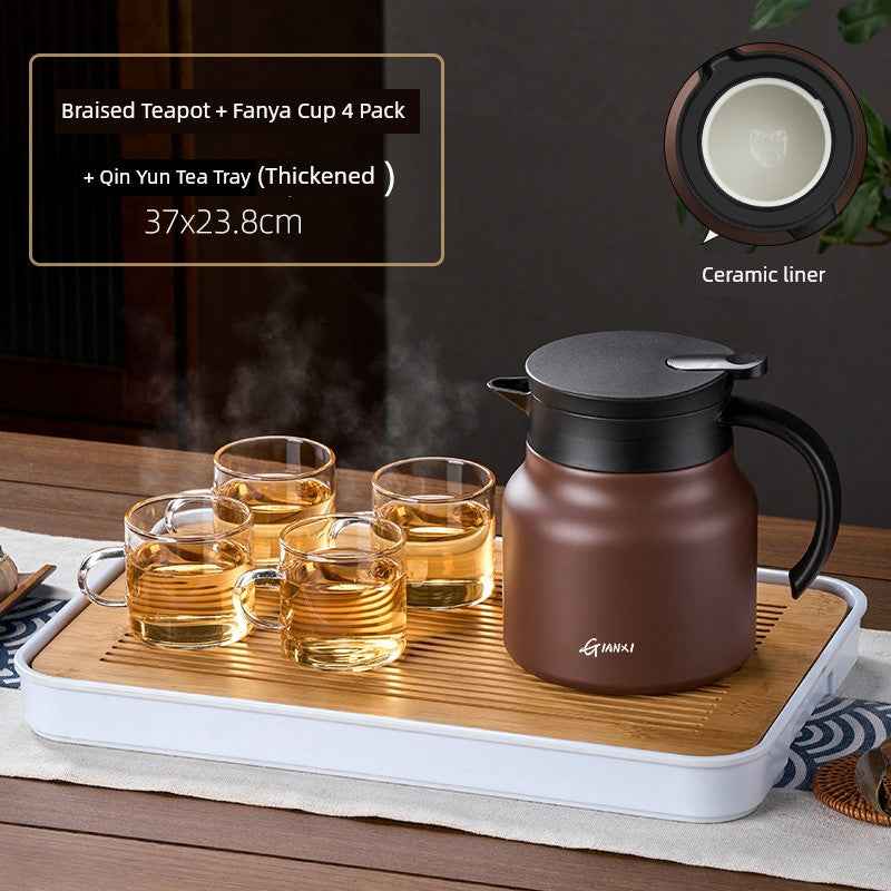 High-quality braised teapot with ceramic liner and glass cups on a wooden tea tray set
