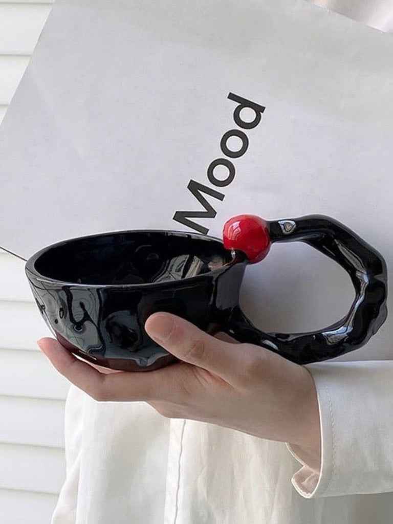 INSPECIAL HOME handmade ceramic coffee mugs in black with unique twisted handle and red accent detail