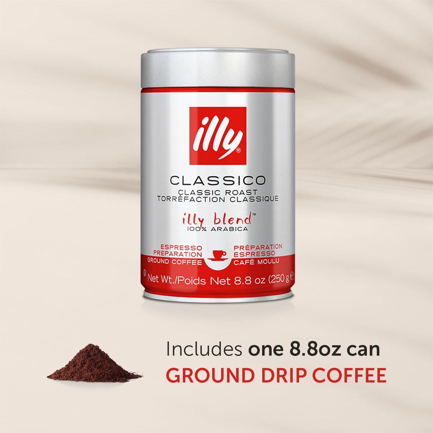 Illy ground espresso coffee in an 8.8oz silver and red canister with ground coffee pile beside it