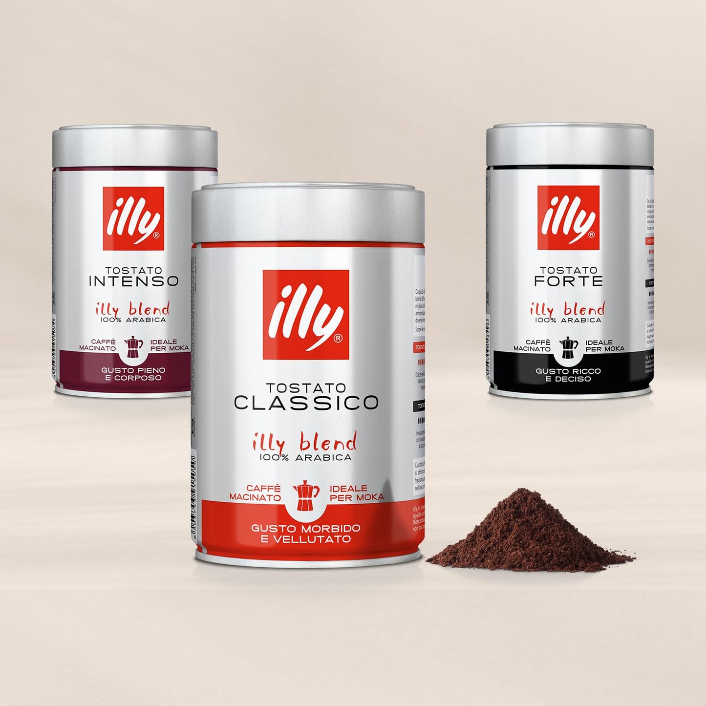 Illy ground espresso coffee tins in Classico, Intenso, and Forte with ground coffee pile displayed