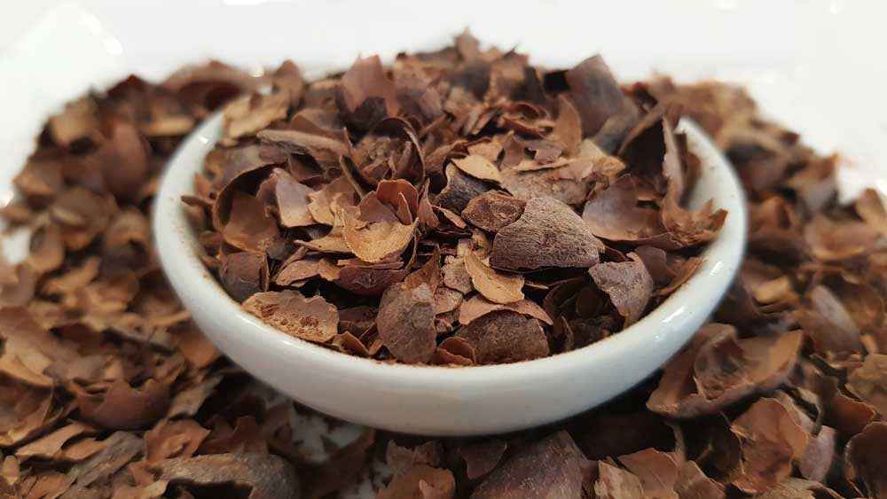 Handcrafted Yerba Mate Blend herbal tea leaves in a white bowl by ISLAND SHARKS CHOCOLATE