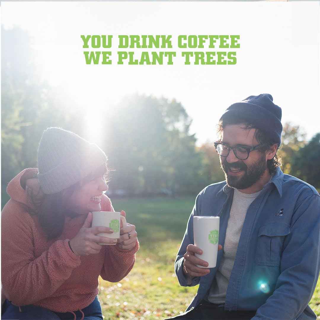 Two people enjoying Fair trade organic coffee beans outdoors with text You drink coffee we plant trees