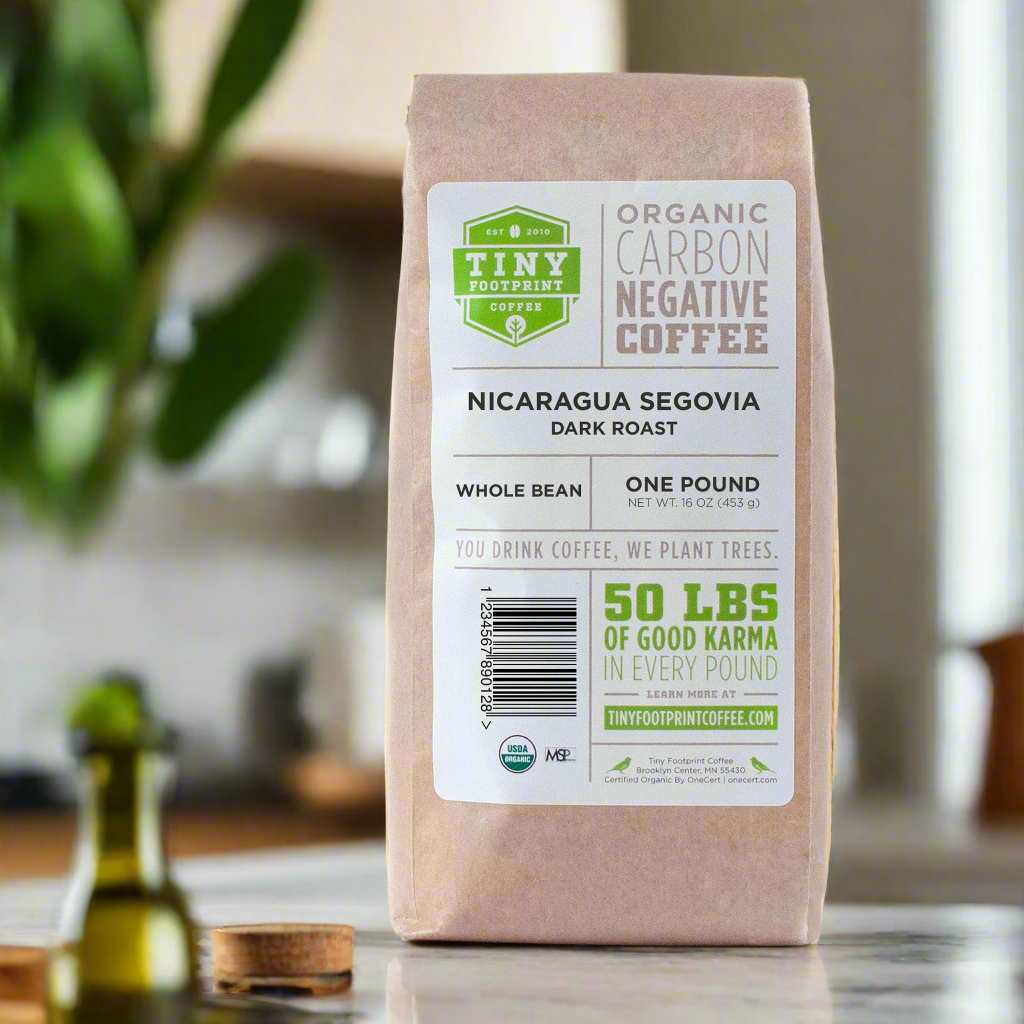 Fair trade organic coffee beans in a brown bag labeled Nicaragua Segovia dark roast whole bean coffee