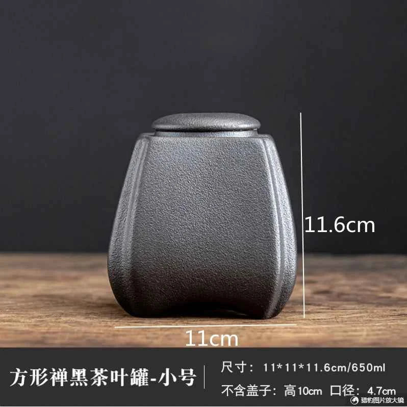 Black sealed tea storage jar with a textured finish and compact size from Tea & coffee of the world