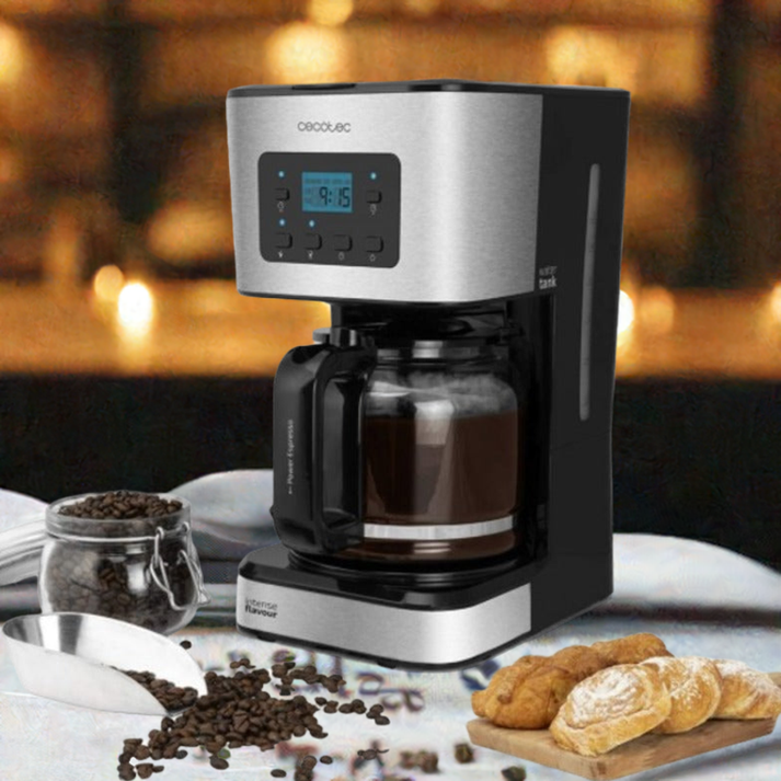 Premium coffee accessories set featuring a modern drip coffee maker with coffee beans and pastries