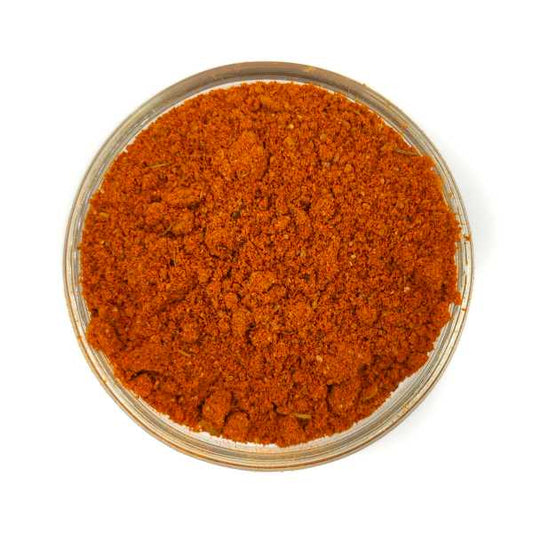 Tea & Coffee of the World authentic Spanish seasoning blend ground spice in a clear bowl