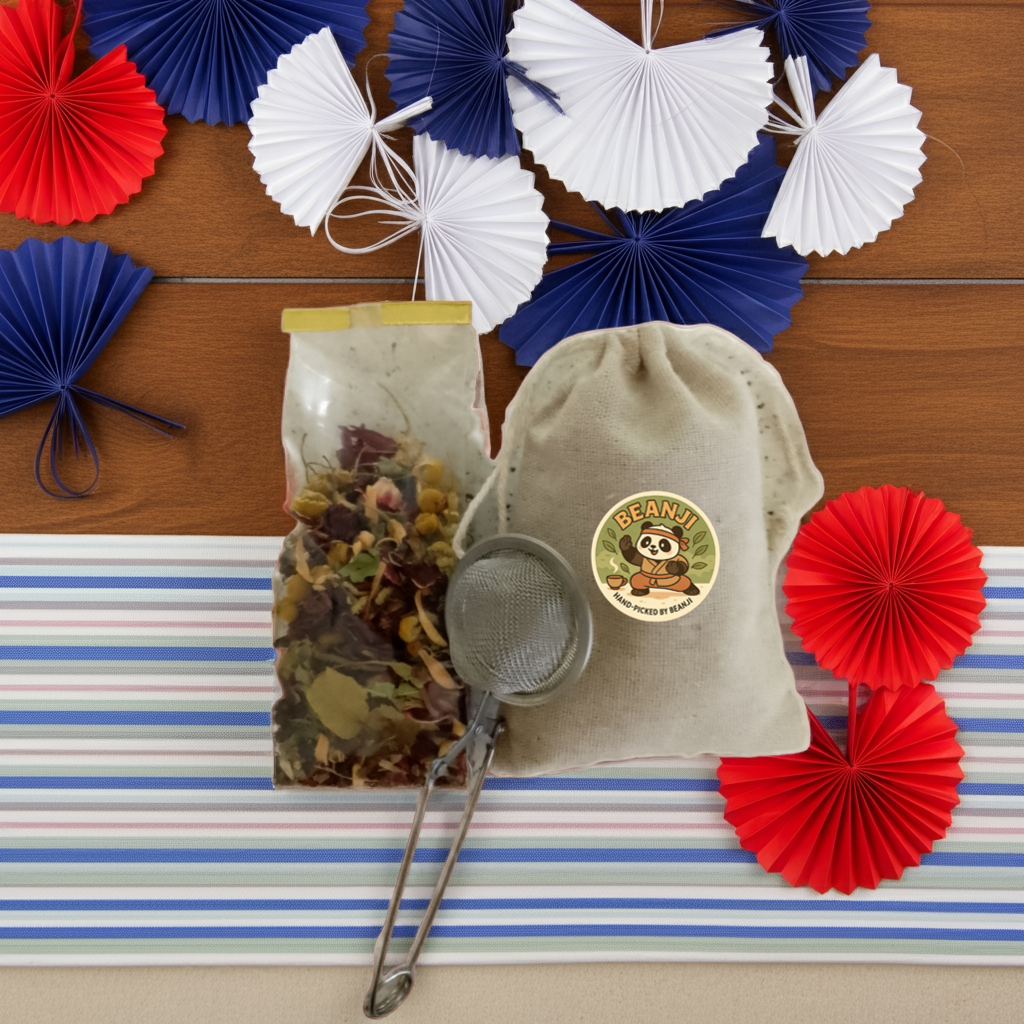 Lemon hibiscus herbal tea blend in a clear bag with tea infuser and beige pouch on striped surface