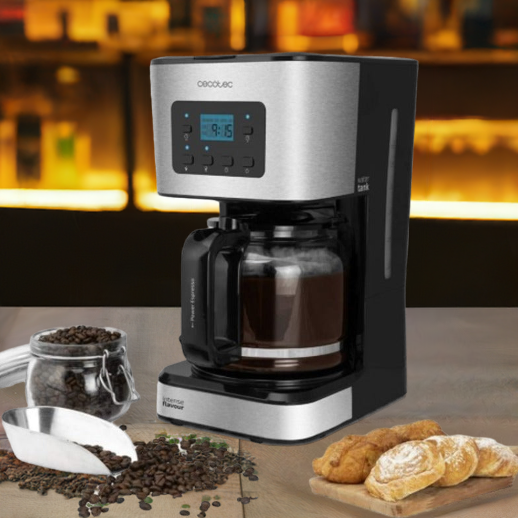 Cecotec coffee maker brewing fresh organic coffee with coffee beans and pastries on table