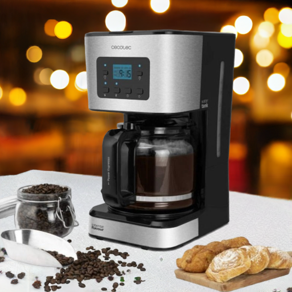 Cecotec coffee maker brewing organic coffee with coffee beans and pastries on table