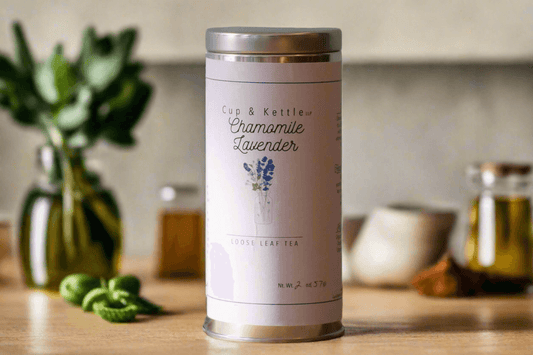 DC-Cup & Kettle Tea handcrafted chamomile tea tin with lavender on wooden surface with blurred background