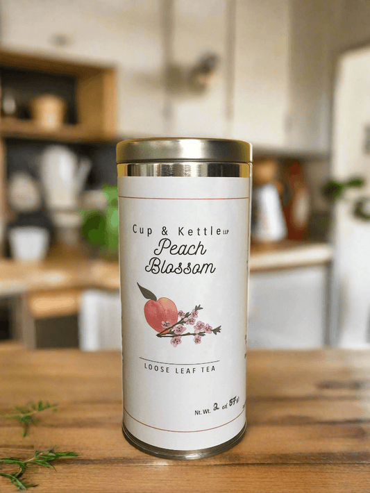 DC-Cup & Kettle Tea Peach Blossom Loose Leaf Tea tin with peach fruit and blossom design on label