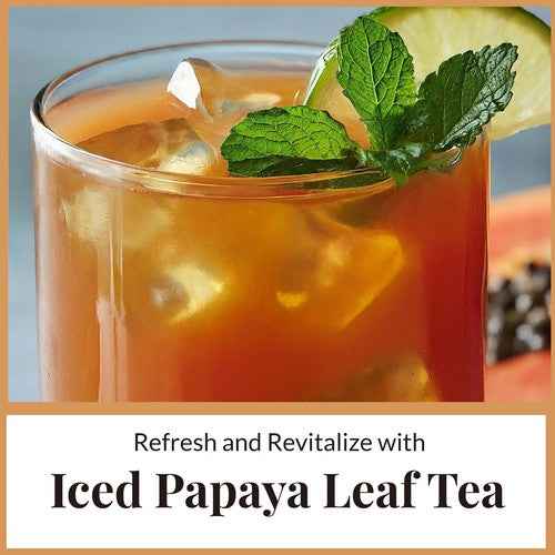 Iced organic papaya leaf tea with mint garnish and papaya slice from Tea & coffee of the world