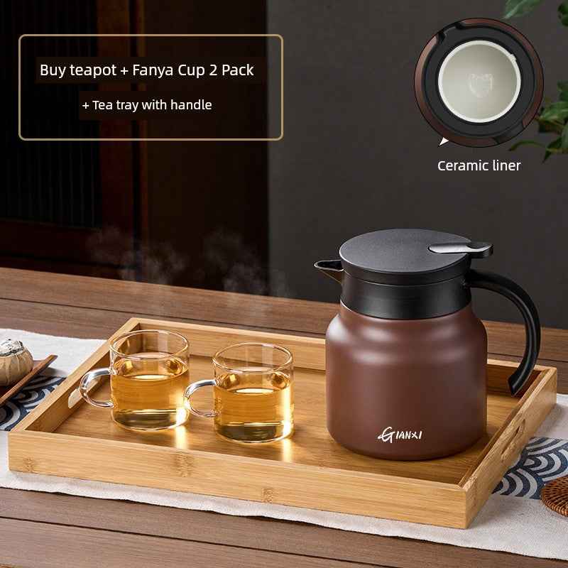 High-quality braised teapot with ceramic liner and two clear glass cups on bamboo tea tray with handle
