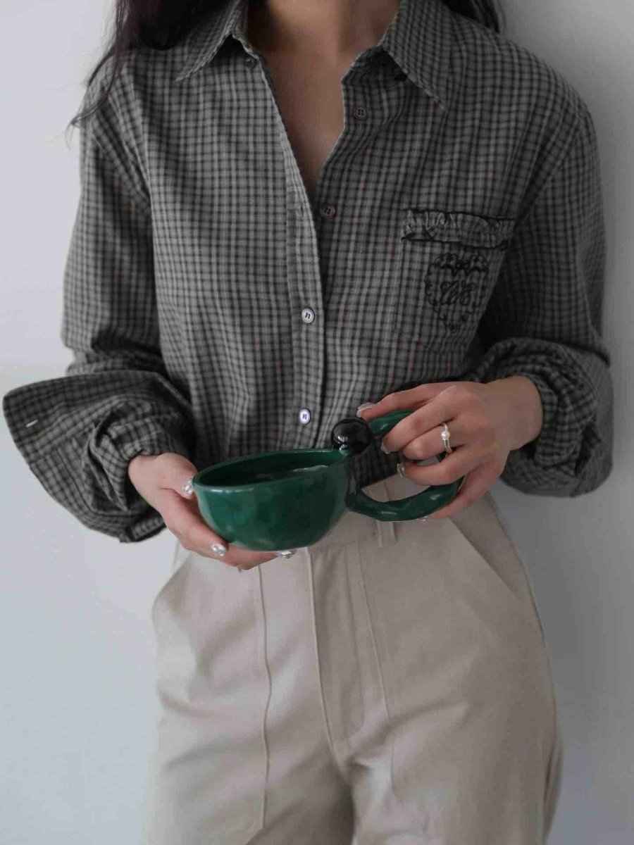 Person holding dark green handmade ceramic coffee mugs with unique glaze finish from INSPECIAL HOME accessories