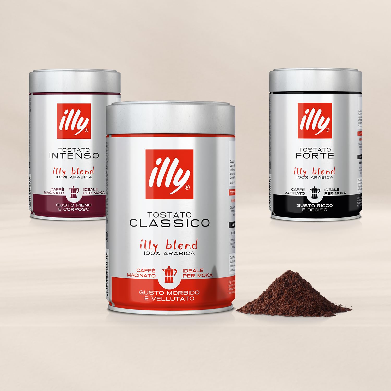 Illy ground espresso coffee tins in Classico, Intenso, and Forte with ground coffee pile displayed