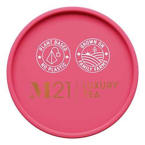 Top view of DC-Tega Tea premium wellness tea canister lid with plant based and family farm icons