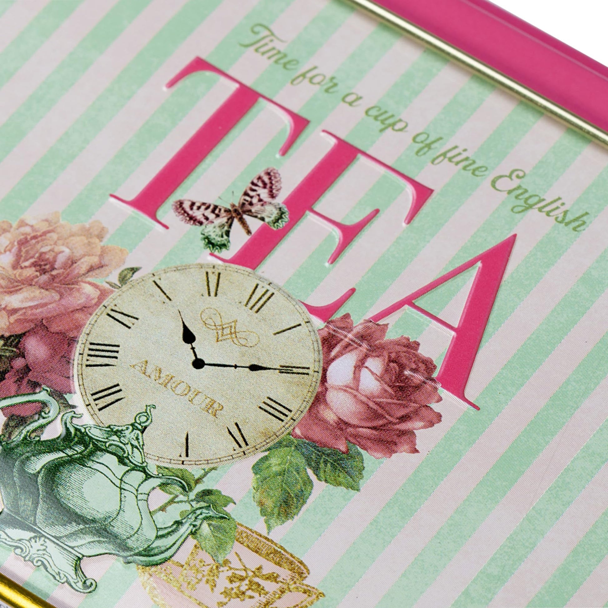 English tea in vintage tin with floral design, clock illustration, and striped background